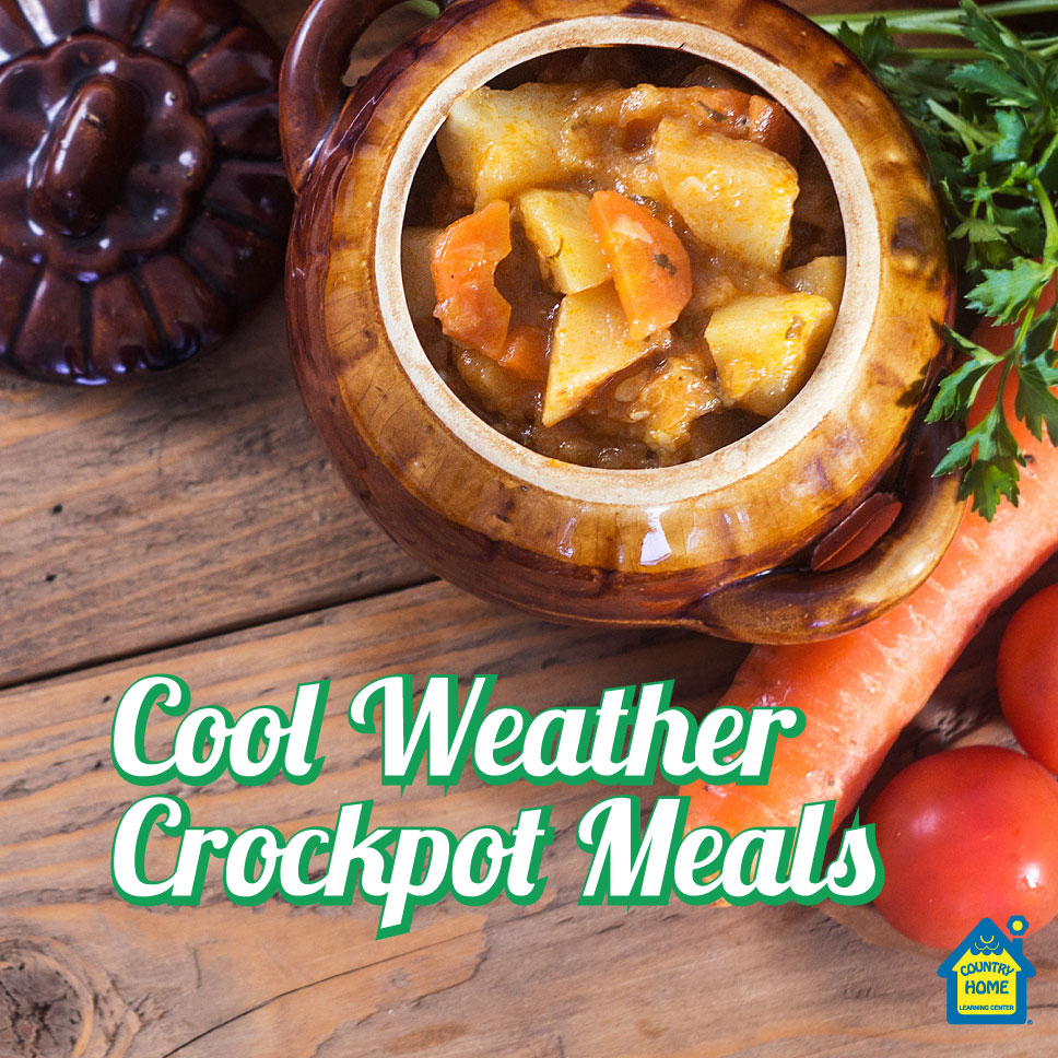A crockpot filled with vegetable stew sits on a wooden table next to fresh carrots and tomatoes; text reads “Cool Weather Crockpot Meals.”.