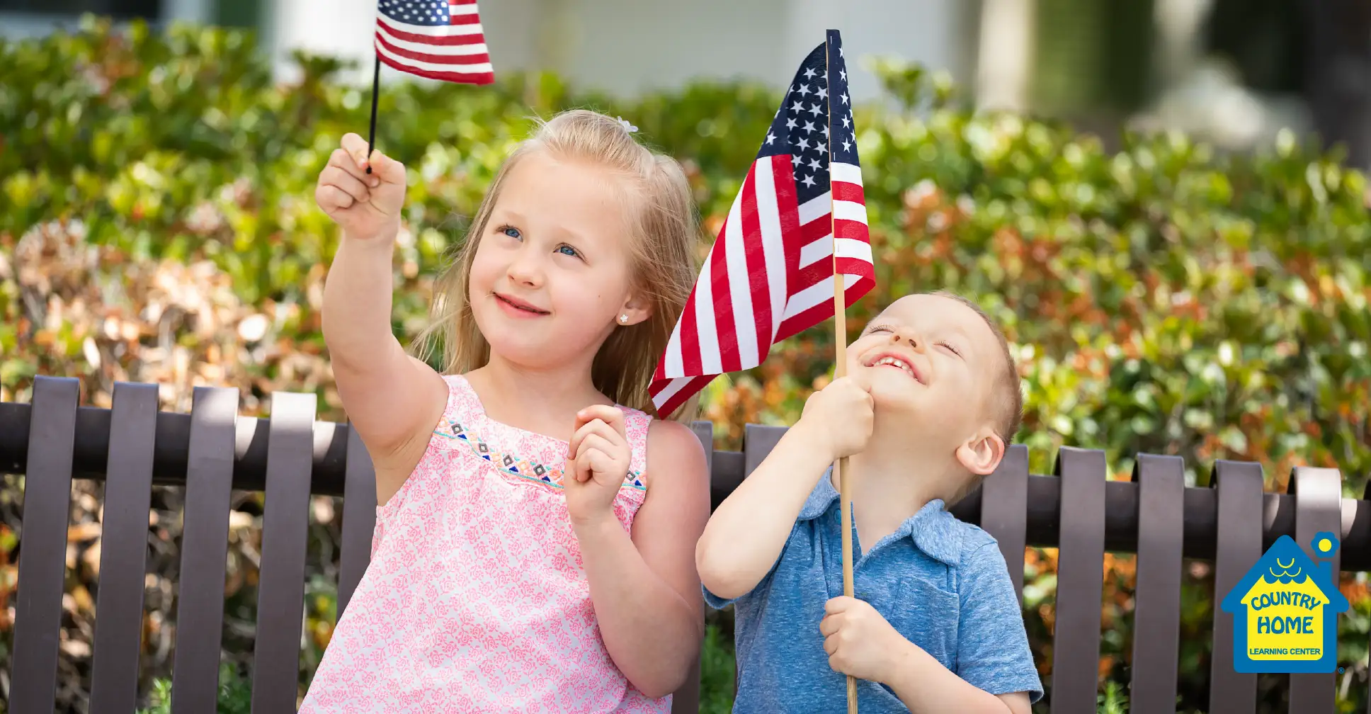Kids waving American Flags for Flag Day.