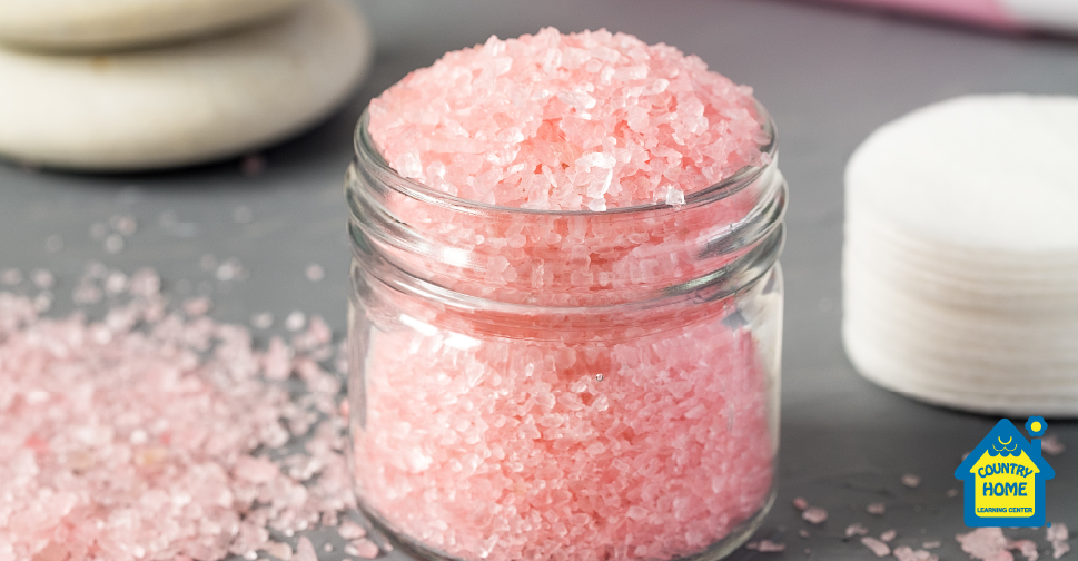 pink bath salts in a glass jar