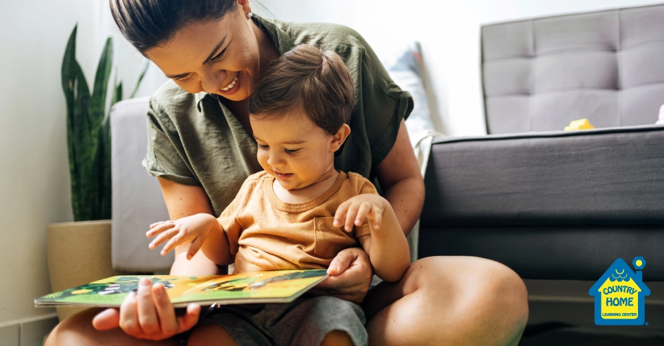 young mom reading an illustrated toddler book to her child