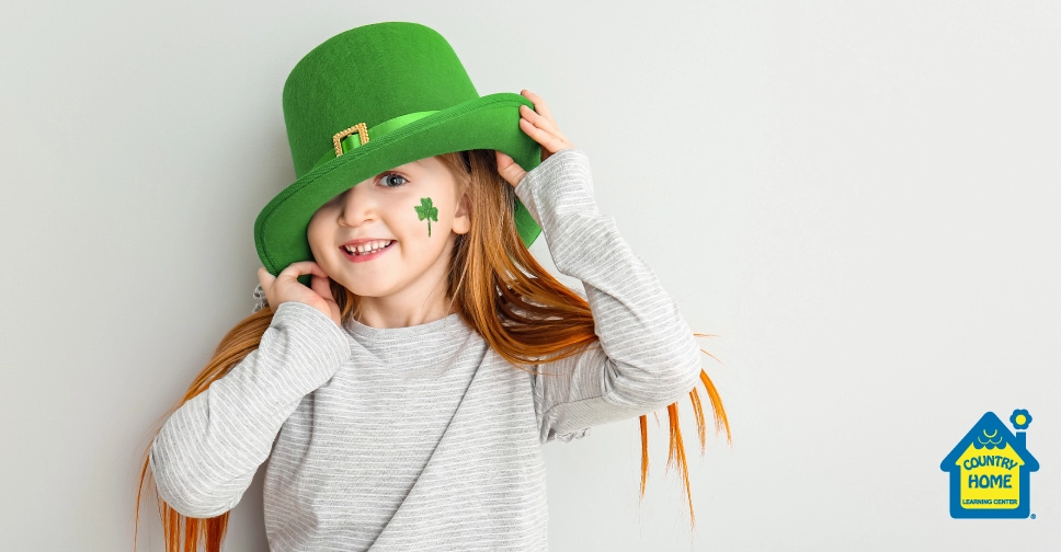 red head girl wearing a green st. Patrick's day hat