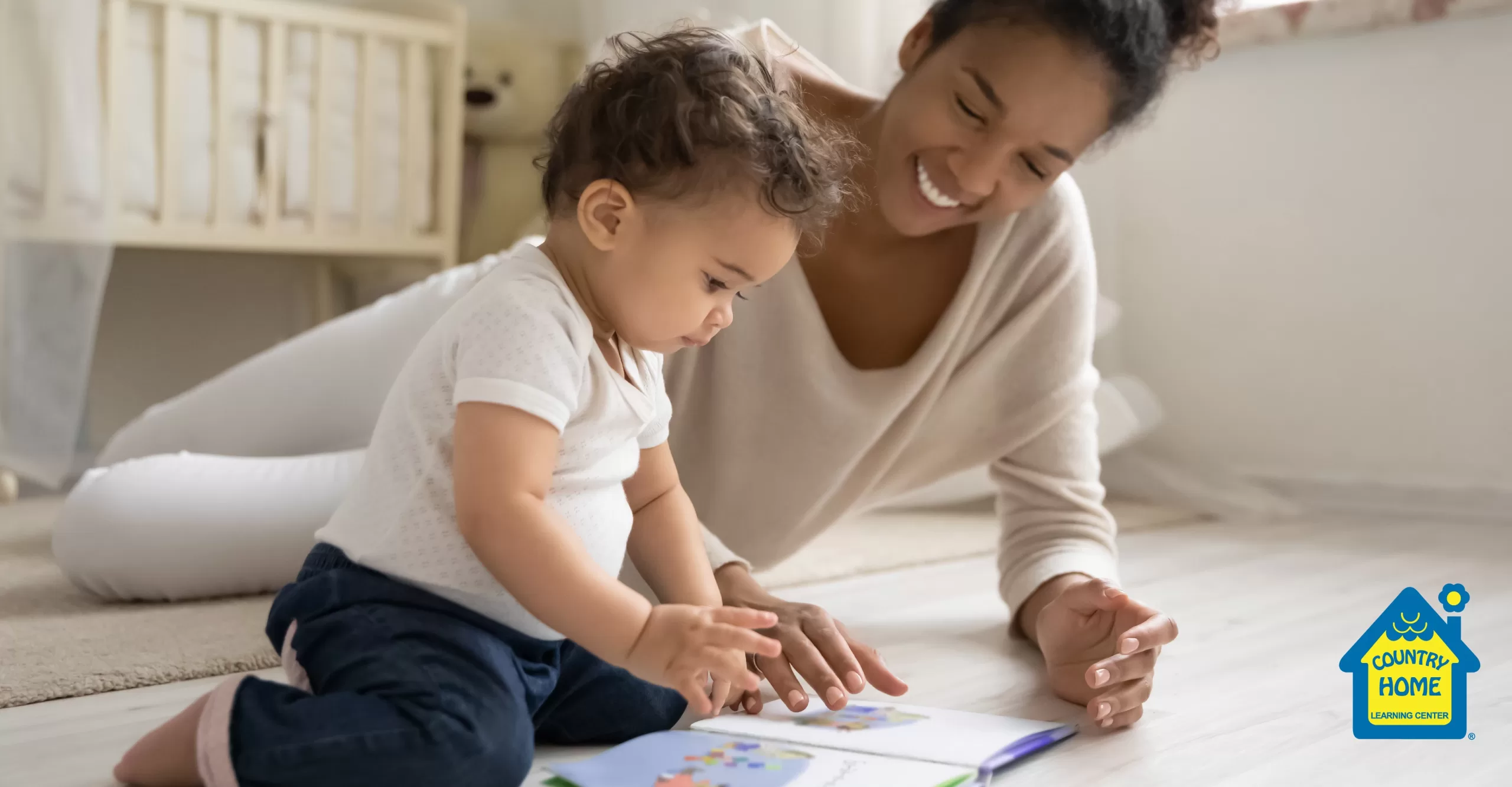 young mom reading book with toddler