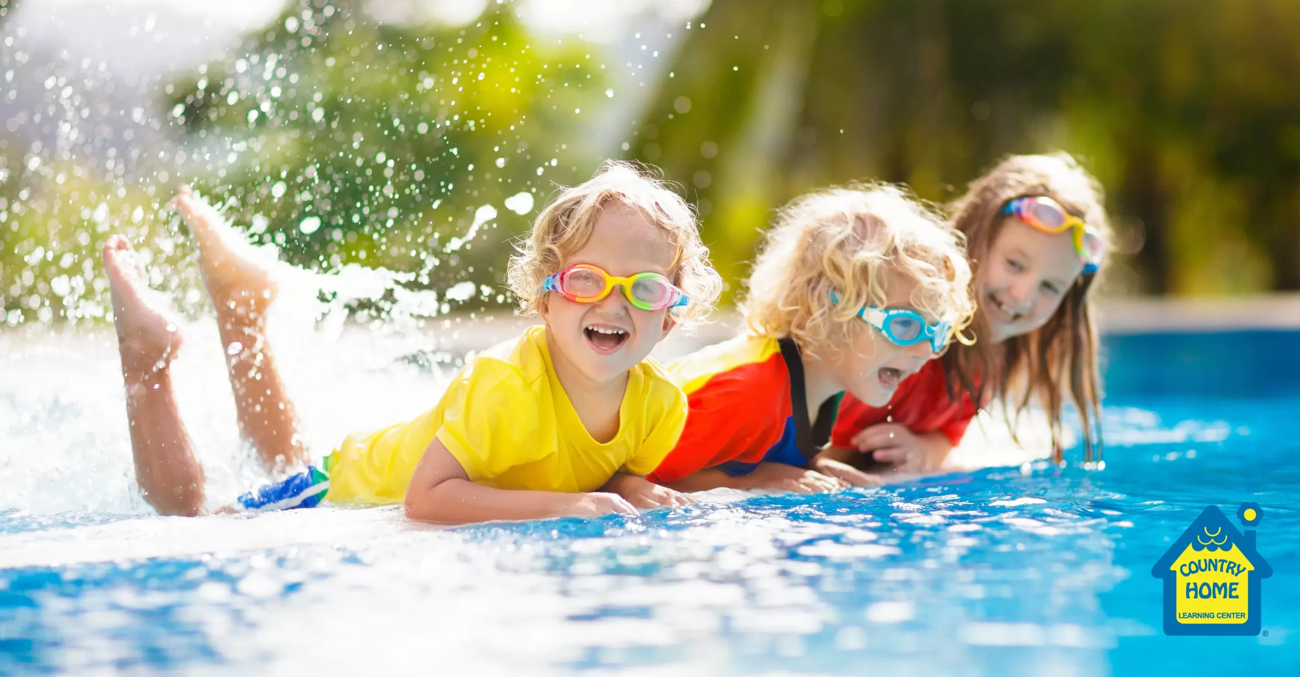kids enjoying slashing in a pool during the summer