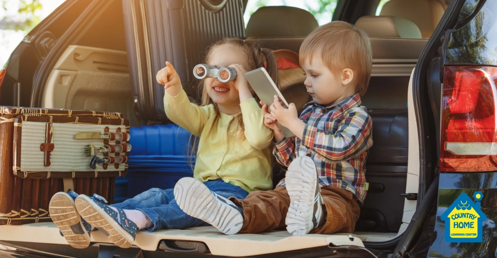 two young children traveling in a car