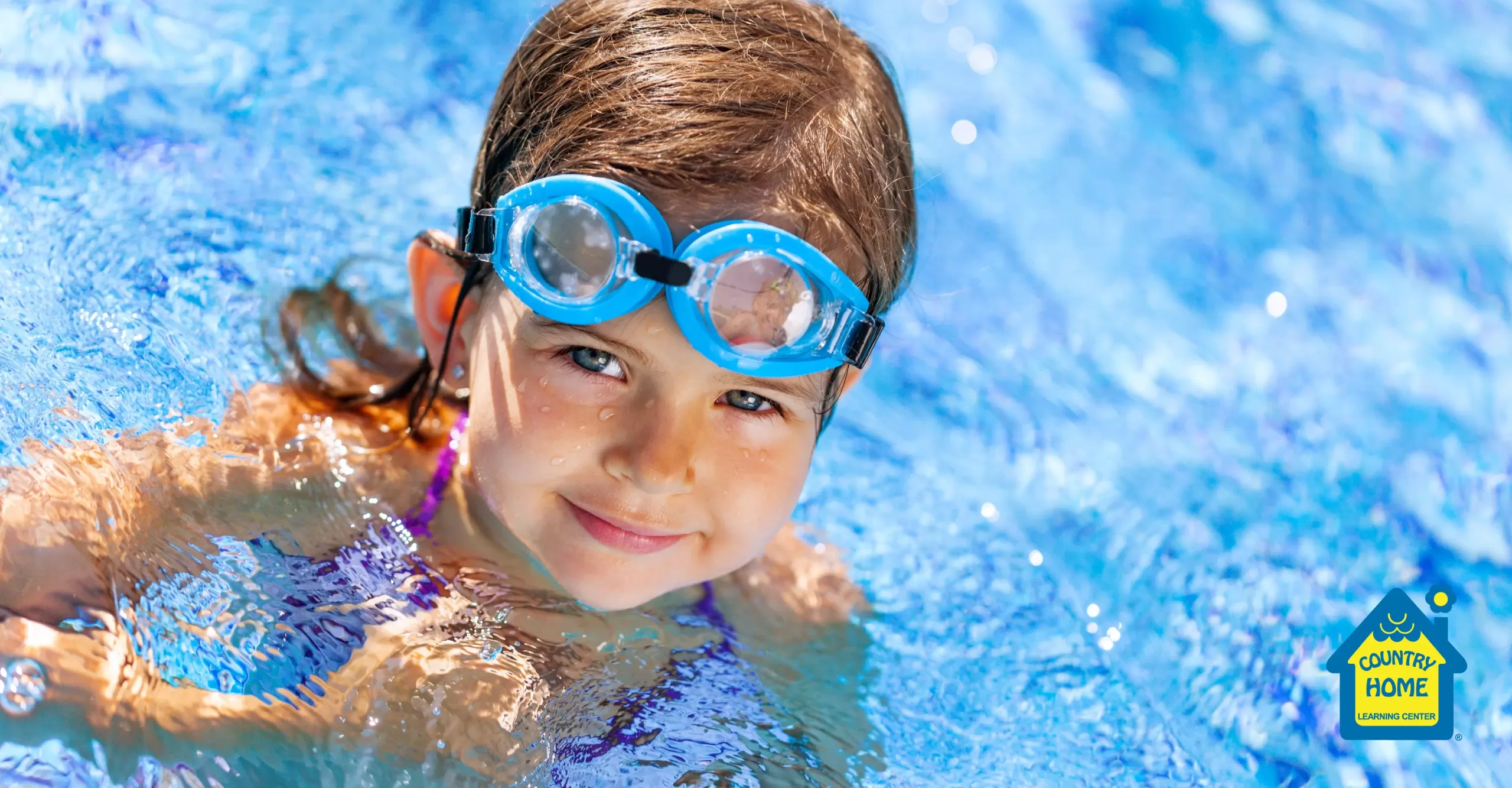 young girl swimming in a pool