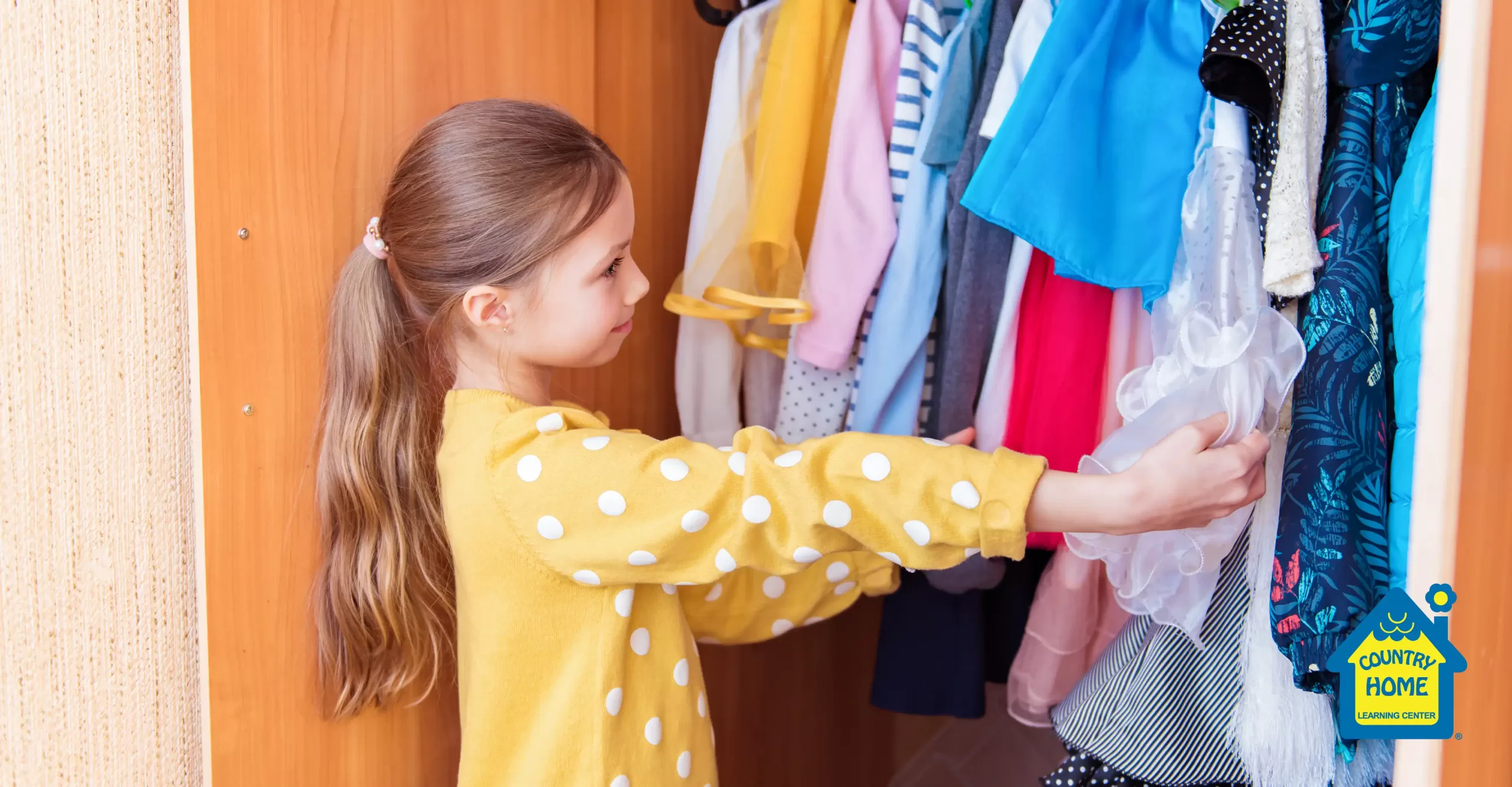 little girl picks out an outfit from her closet to wear to school