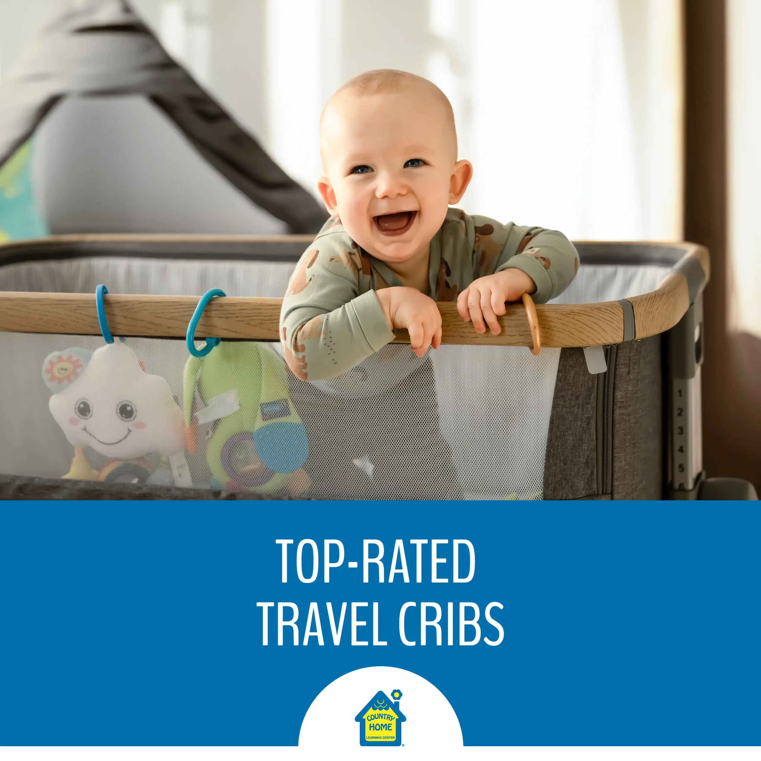 a baby smiles with happiness in a travel crib