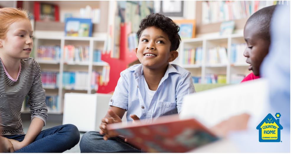 Young boy sitting in library listening to story