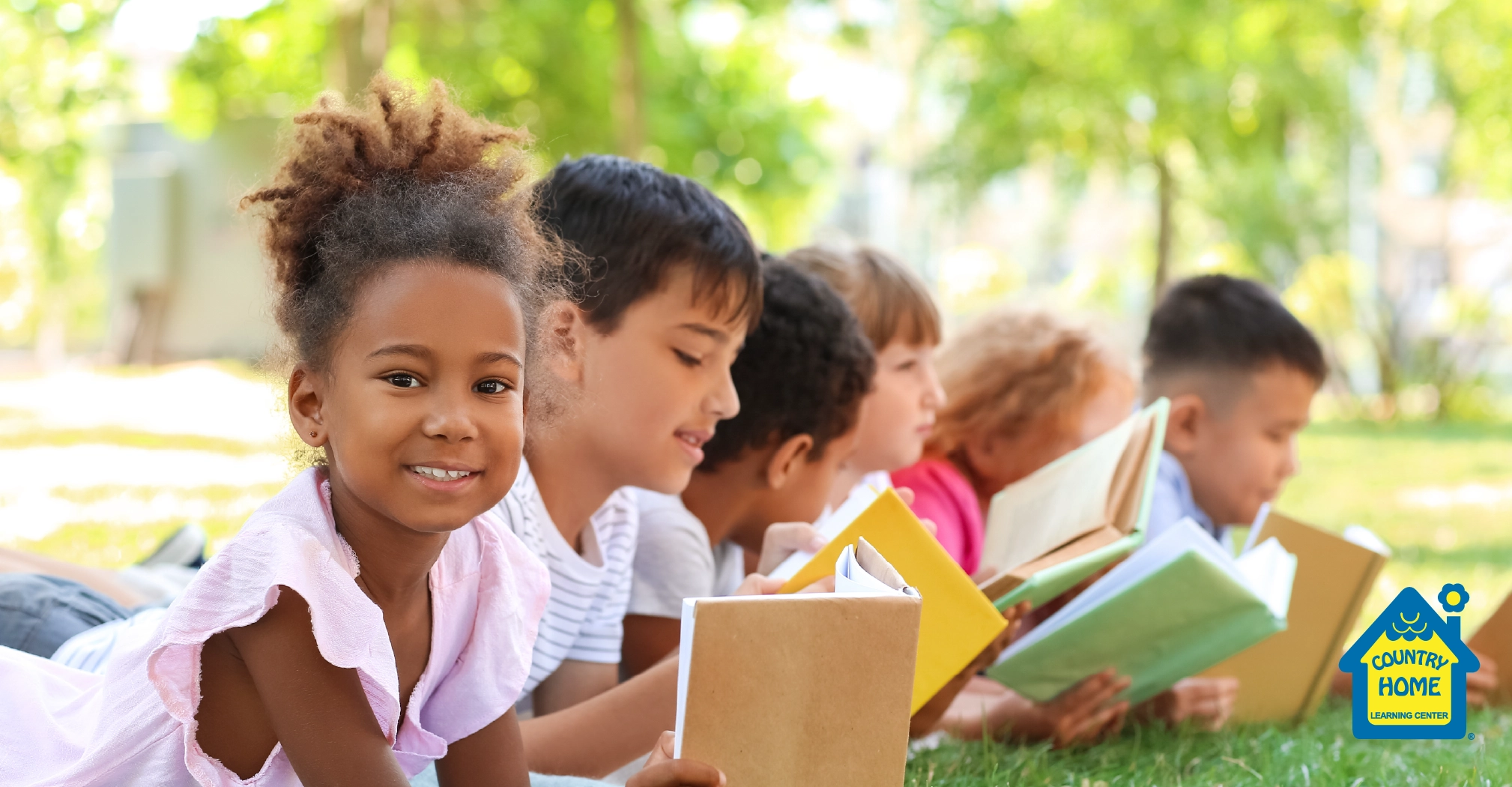 Children reading and learning outdoor to benefit their education.