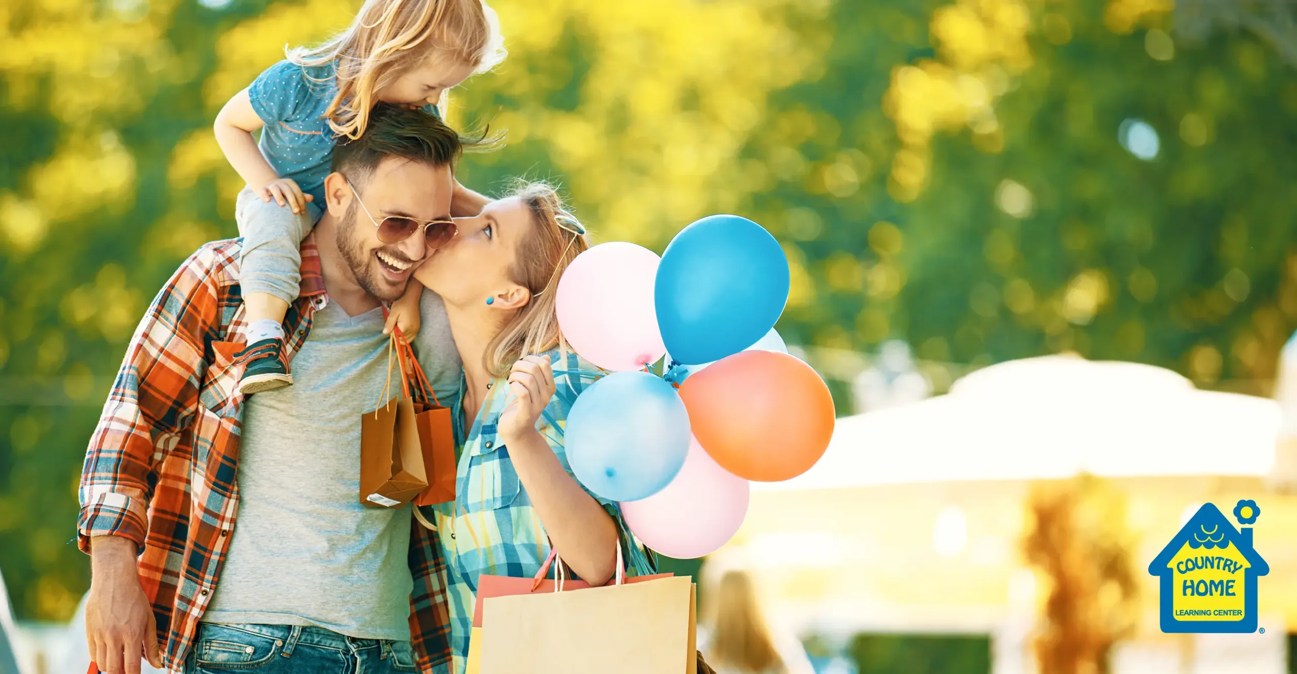 Local family carrying balloons and shopping bags with purchases from small businesses.