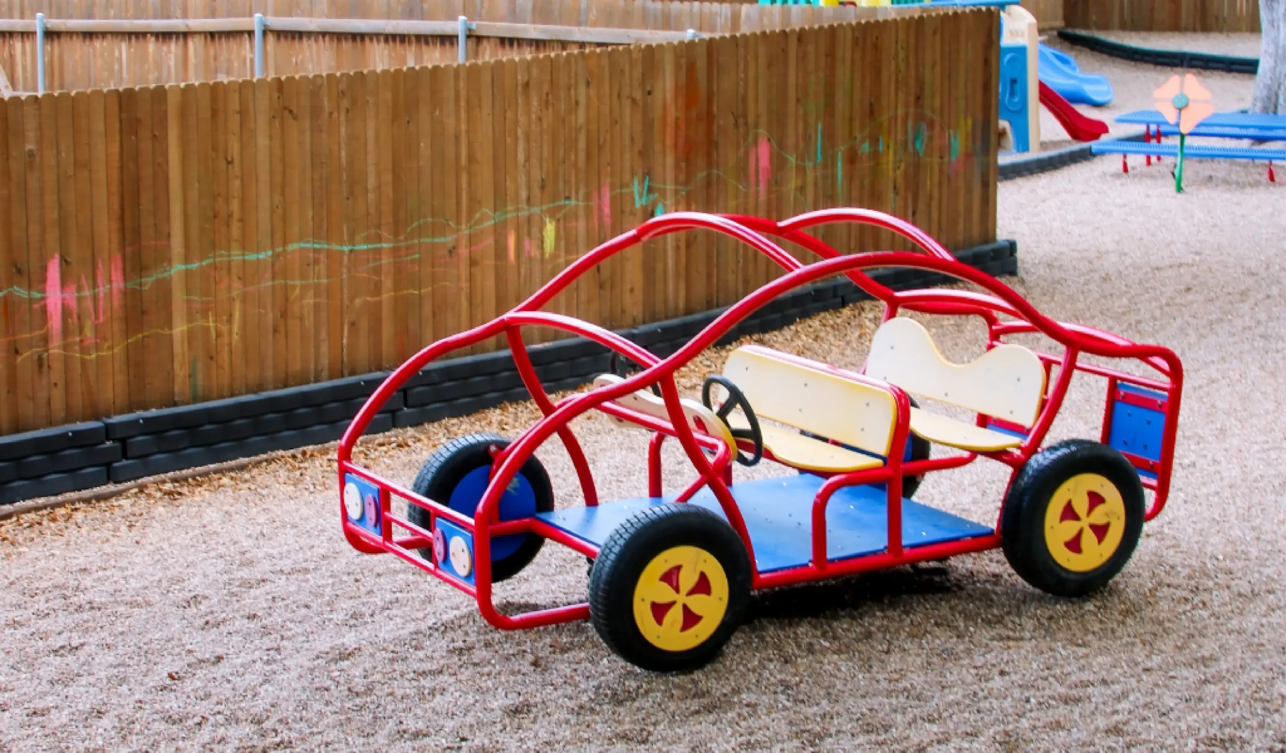 a play car on the daycare playground of Country Home Learning Center Southwest Austin