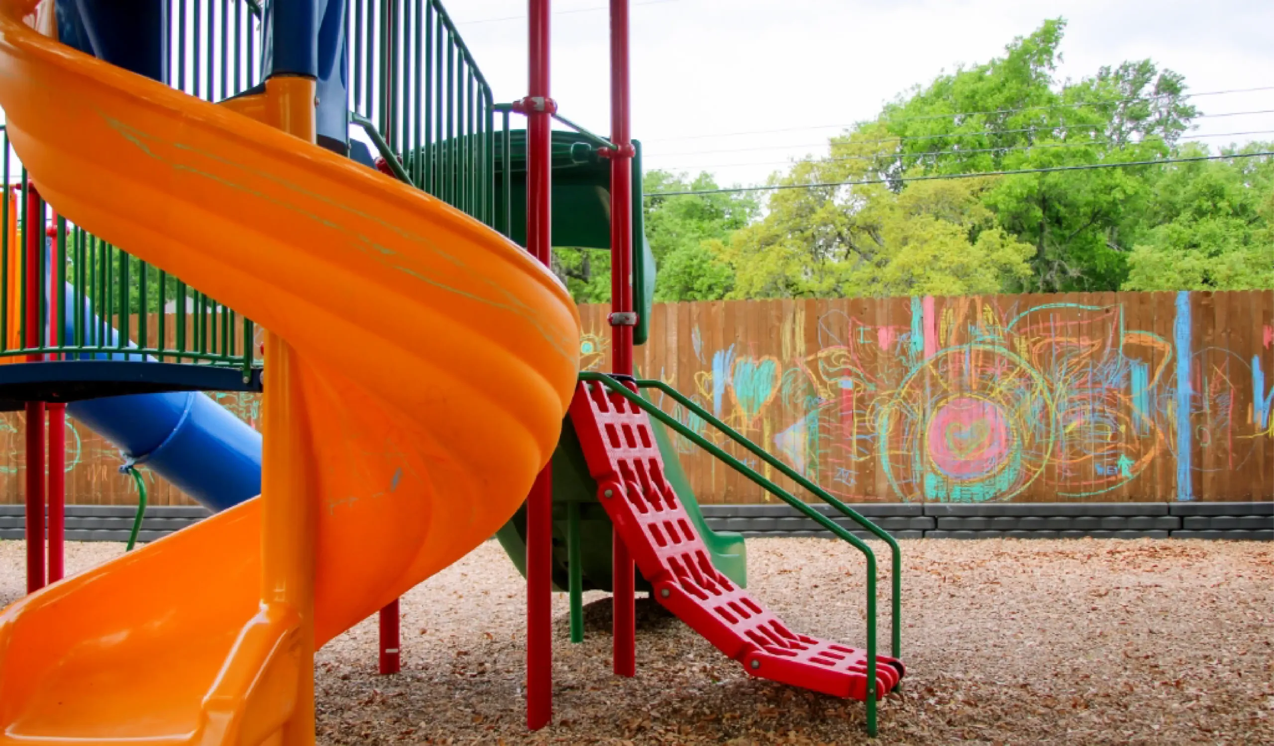 an orange twisty slide at Country Home Learning Center's Southwest location