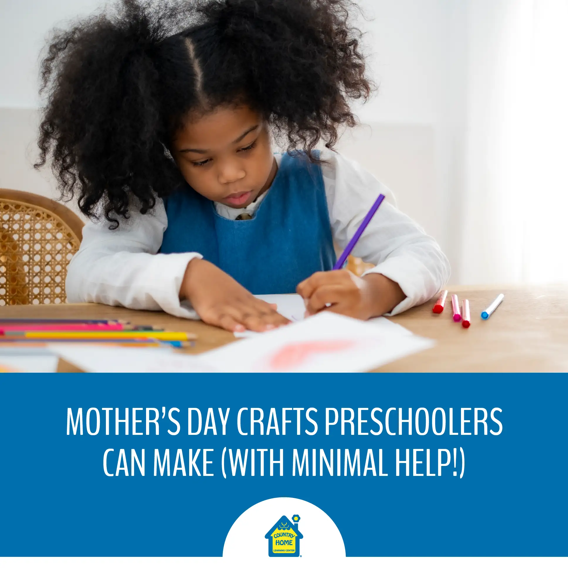 Little girl making a card for Mother's Day.