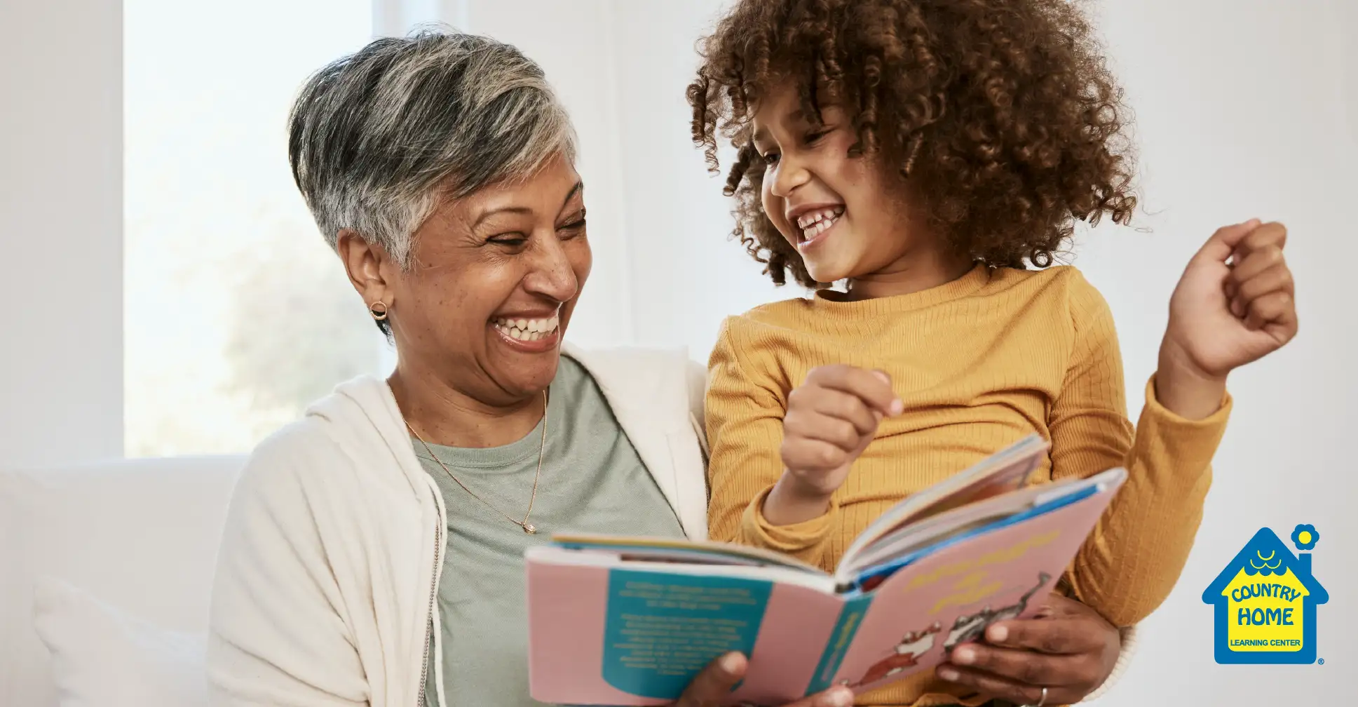Grandmother reading book with grandchild.