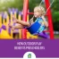 Preschooler playing outside, swinging on the swings.