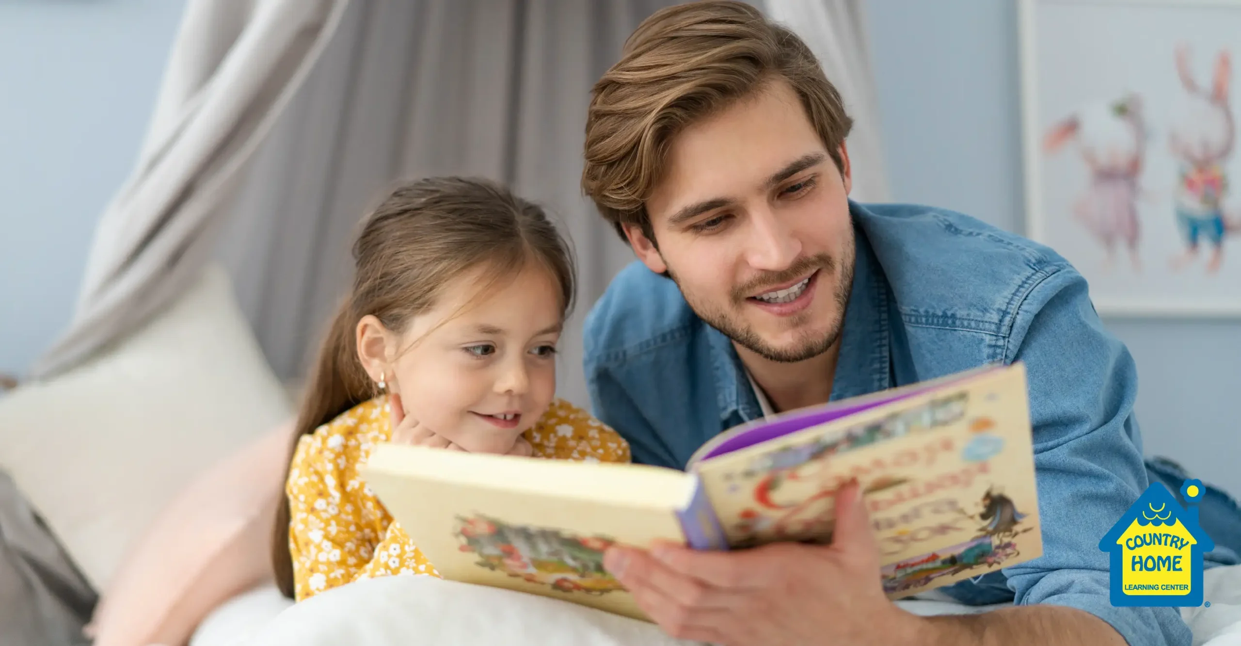 Father and daughter reading a book together before bed.