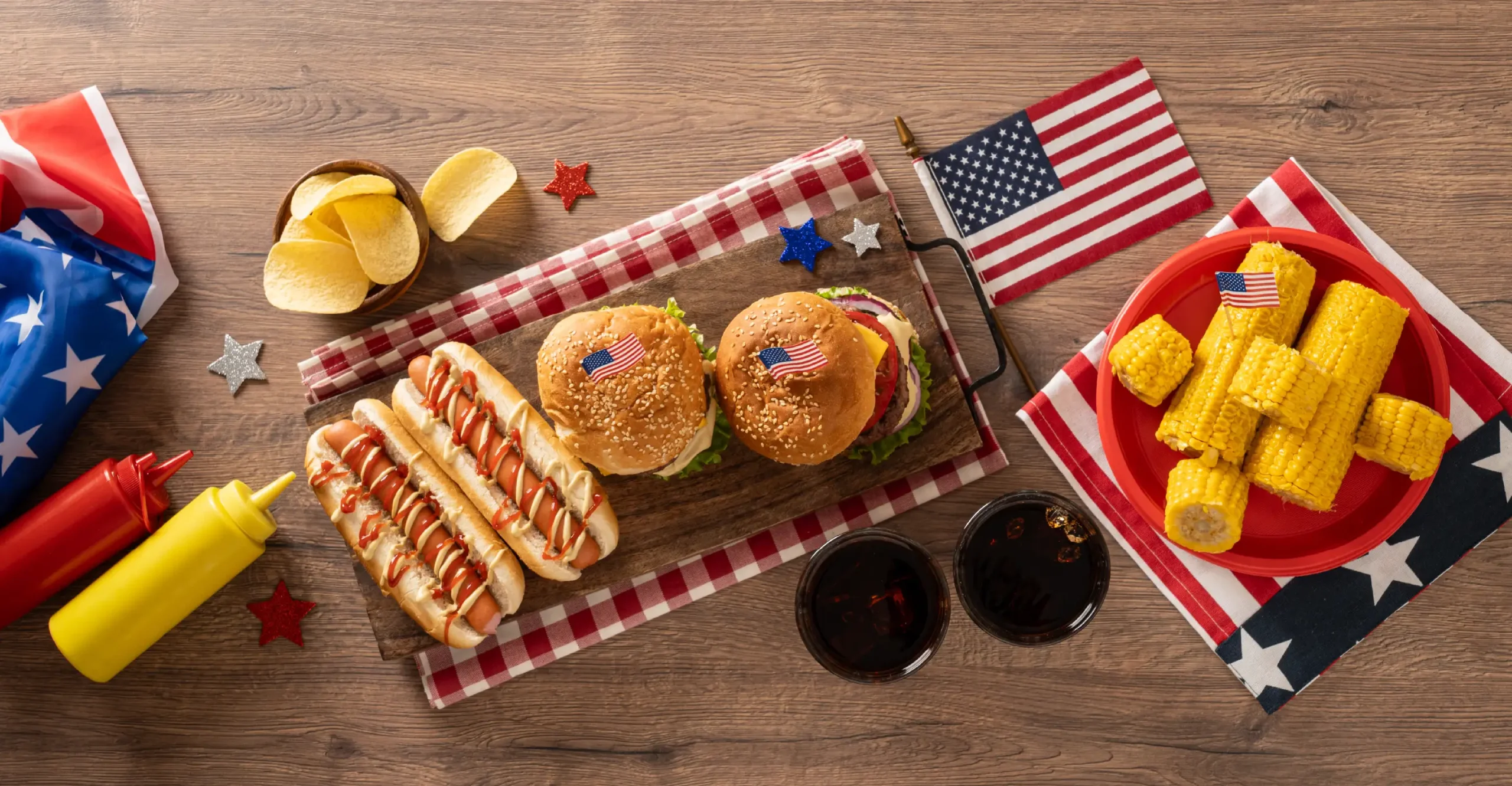 Hamburgers, hotdogs, and corn on the cob on the Fourth of July.