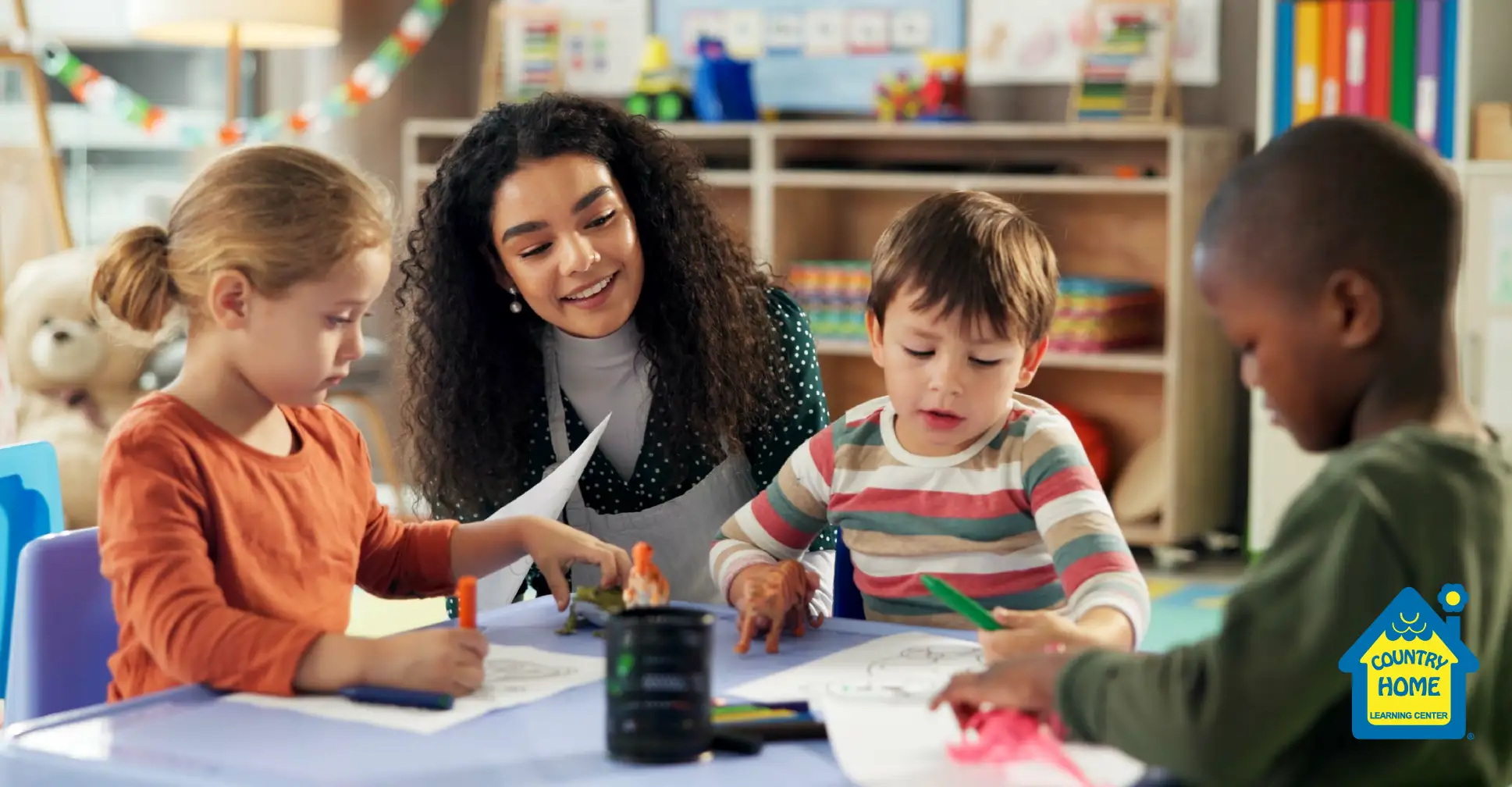 A teacher helping her kindergartners with coloring at school.